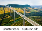 Aerial view of multispan cable stayed Millau Viaduct across gorge valley of Tarn River in Southern France in summer