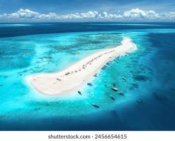 Aerial view of Nakupenda island, sandbank in ocean, white sand, boats, yachts, blue sea during low tide at sunny summer day in Zanzibar. Top view of sand spit, clear water, sky with clouds. Tropical - Powered by Shutterstock