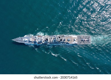 Aerial View Of Naval Ship, Battle Ship, Warship, Military Ship Resilient And Armed With Weapon Systems, Though Armament On Troop Transports. Support Navy Ship. Military Sea Transport.