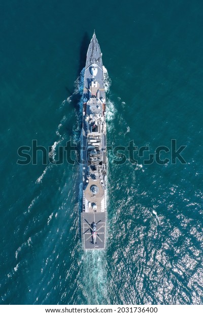 Aerial view of\
naval ship, battle ship, warship, Military ship resilient and armed\
with weapon systems, though armament on troop transports. support\
navy ship. Military sea\
transport.