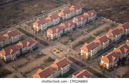 An Aerial View Of A Neighborhood Of New Houses In The Golden Hour Just Before Sunset In Siem Reap, Cambodia.