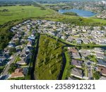 An aerial view of a neighborhood of New Port Richey, Florida surrounded by greenery