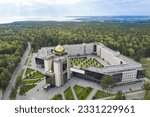 Aerial view of the new building of Novosibirsk State University against the background of the Siberian taiga and the Ob River in autumn 2022