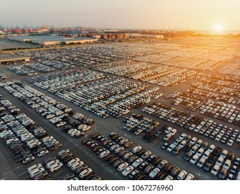 Aerial View A Lot Of New Car For Import And Export Shipping By Ship , Smart Dealership At Car Depot.