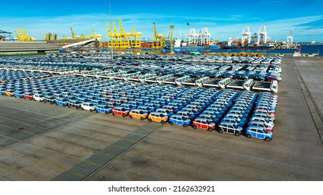 Aerial View A Lot Of New Car For Import And Export Shipping By Ship , Smart Dealership At Car Depot, Car At Car Park Before Shipping To Customer, After Production Industry