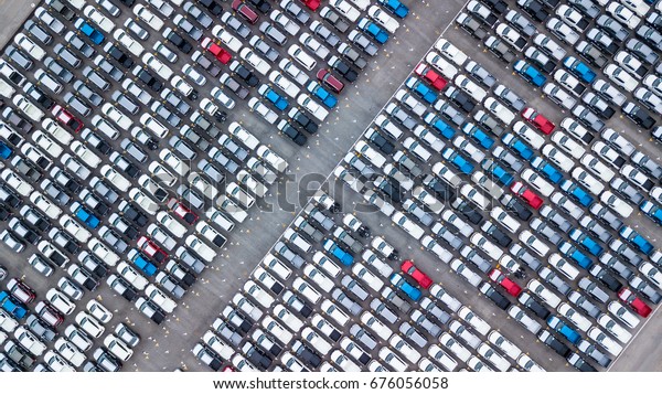 Aerial
view new car lined up in the port for import and export business
logistic to dealership for sale, Automobile and automotive car
parking lot for commercial business 
industry.