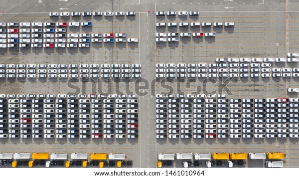 Aerial view new cars export terminal,\
New cars waiting for import export at deep sea\
port.