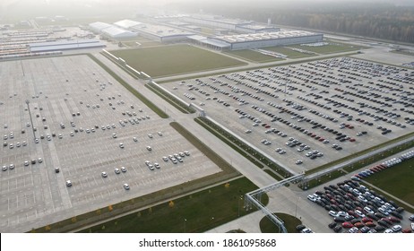 Aerial View Of New Cars Lined Up Parking Outside Factory On Car Factory Background.