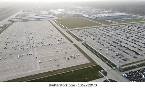 Aerial View Of New Cars Lined Up Parking Outside Factory On Car Factory Background.