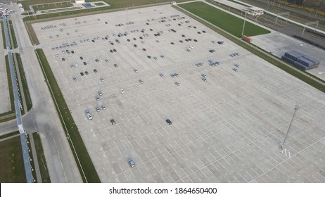 Aerial View Of New Cars Lined Up Parking Outside Factory On Car Factory Background.