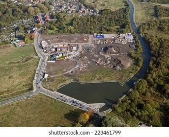 Aerial View Of New Housing Being Constructed On A Brown Field Site In The UK