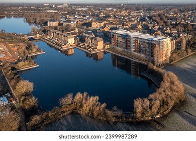 Aerial view of a new housing development with luxury properties overlooking a lake in the lakeside District of Doncaster, UK