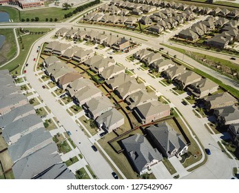 Aerial View New Residential Area Near School District In North Dallas, Texas, USA. Flyover Row Of Brand New Single-family Houses With Gardens