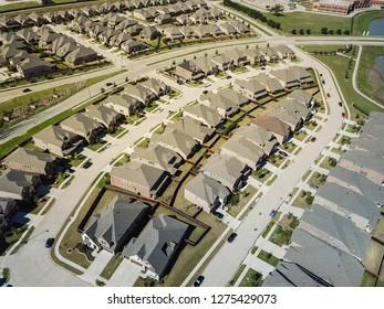 Aerial View New Residential Area Near School District In North Dallas, Texas, USA. Flyover Row Of Brand New Single-family Houses With Gardens