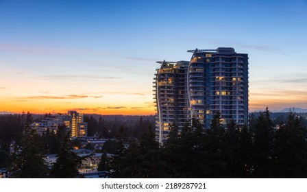 Aerial View of a New Residential Property Building. Modern Architectural Design in a suburban city. White Rock, Vancouver, British Columbia, Canada. Sunset Sky