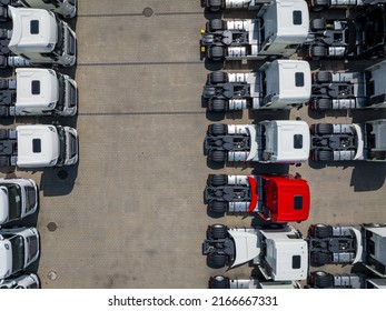 Aerial View New Trucks Lined Up In The Port For Import And Export Business Logistic To Dealership For Sale, Automobile And Automotive Truck Parking Lot For Commercial Business Industry.