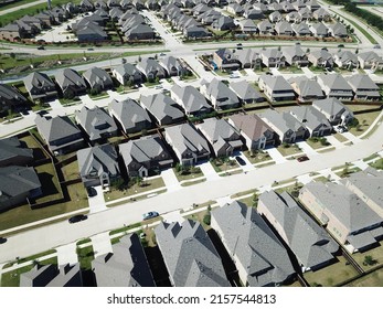 Aerial View New Upscale Residential Neighborhood With Row Of Two Story Houses In North Texas, America. Large Single Family Home With Attached Garage, Single Roofs In A Small Lot Size