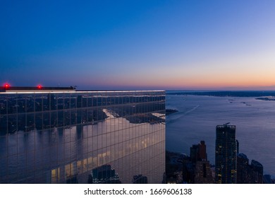 Aerial View Of New York City Manhattan Skyline With Three World Trade Center At Dusk.