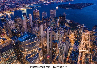 Aerial View Of New York City Manhattan Skyline With Three World Trade Center At Dusk.