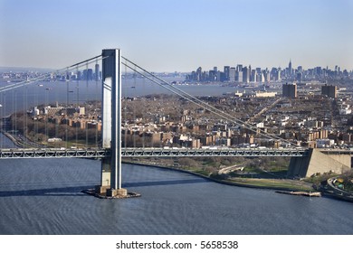 Aerial view of New York City's Verrazano-Narrow's bridge with Manhattan skyline.