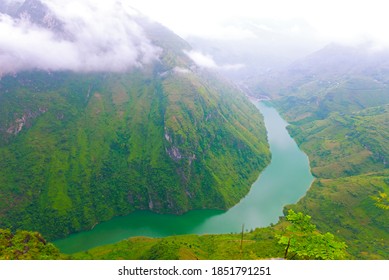 Aerial view of Nho Que River on a foggy morning, with the fabulous emerald hue. It is one of the most beautiful rivers in Northeast Vietnam. (Photo was taken in Ha Giang Province).   