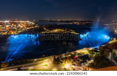 Aerial view of Niagara Falls American Falls Horseshoe Falls night illumination.