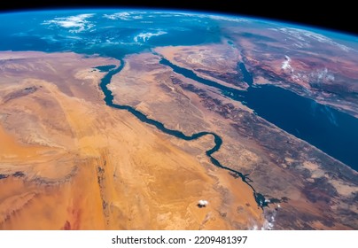 Aerial view of Nile River, Red Sea and Mediterranean Sea. Egypt, Saudi Arabia, Israel and Jordan as seen from space. Satellite view. Elements of this image furnished by NASA. - Shutterstock ID 2209481397