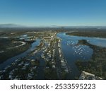 Aerial view of Noosa, Queensland, during sunrise sitting in the shadow of its own national park