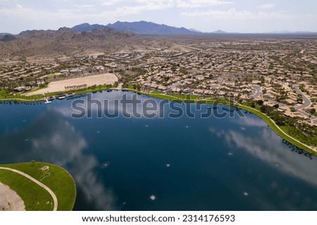 An aerial view of North Lake and Goodyear, Arizona cityscape with mountains in the background