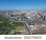 Aerial view of the North Third Ring Road Rainbow Bridge, Jingguang Expressway Interchange, and Zhengzhou North Railway Station in Huiji District, Zhengzhou, China.