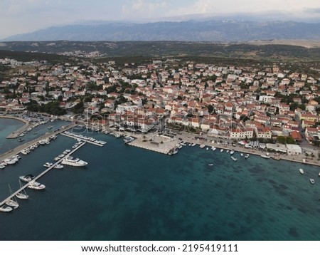 Aerial view of Novalja in Island of Pag, archipelago of Croatia. Panoramic drone view of waterfront, idyllic and turquoise sea in town of Stara Novalja, Adriatic Sea in Dalmatia region.