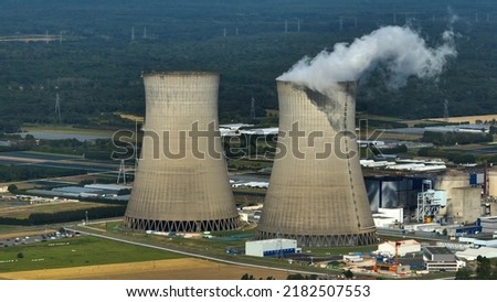 Aerial view to nuclear power plant in France. Atomic power stations are very important sources of electricity with low carbon footprint. Aerial view to big source of emissions in European Union
