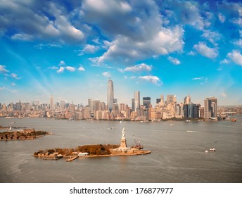 Aerial view of NYC. Statue of Liberty with Manhattan skyline.
