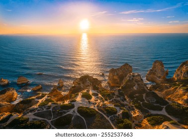 Aerial view of O Elefante rock formation at coast of Algarve, Portugal during sunrise  - Powered by Shutterstock