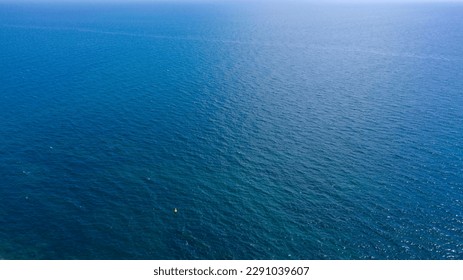 Aerial view of the ocean water surface. The sea is empty and there is no one.