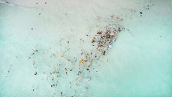Aerial View Of Ocean Waters Polluted With Colorful Plastic Debris And Waste, Highlighting Environmental Concerns Related To Pollution And Marine Conservation
