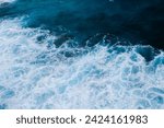 Aerial View of Ocean Waves Crashing into Rocky Coastline