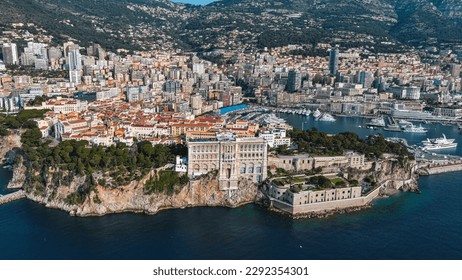 Aerial view of The Oceanographic Museum in Monaco Ville, South France. Prince Palace on the rock in Mediterranean Sea and Old Town around the famous port and marina from above of Monte Carlo 5.5K UHD