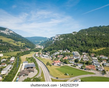 Aerial View Oensingen Switzerland Highway Intersection Traffic And Urban Sprawl Close To Jura Mountains