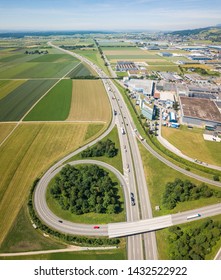 Aerial View Oensingen Switzerland Highway Intersection Traffic And Urban Sprawl Close To Jura Mountains