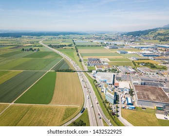 Aerial View Oensingen Switzerland Highway Intersection Traffic And Urban Sprawl Close To Jura Mountains