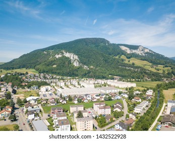 Aerial View Oensingen Switzerland Highway Intersection Traffic And Urban Sprawl Close To Jura Mountains