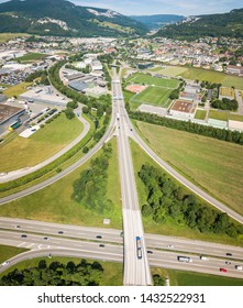 Aerial View Oensingen Switzerland Highway Intersection Traffic And Urban Sprawl Close To Jura Mountains