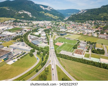 Aerial View Oensingen Switzerland Highway Intersection Traffic And Urban Sprawl Close To Jura Mountains