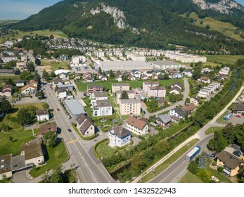 Aerial View Oensingen Switzerland Highway Intersection Traffic And Urban Sprawl Close To Jura Mountains