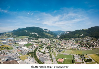 Aerial View Oensingen Switzerland Highway Intersection Traffic And Urban Sprawl Close To Jura Mountains