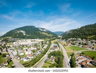 Aerial View Oensingen Switzerland Highway Intersection Traffic And Urban Sprawl Close To Jura Mountains