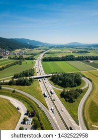 Aerial View Oensingen Switzerland Highway Intersection Traffic And Urban Sprawl Close To Jura Mountains