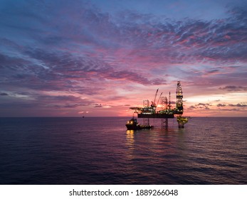 Aerial view offshore drilling rig (jack up rig) at the offshore location during sunset - Shutterstock ID 1889266048