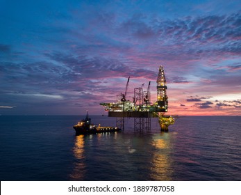 Aerial view offshore drilling rig (jack up rig) at the offshore location during sunset - Shutterstock ID 1889787058